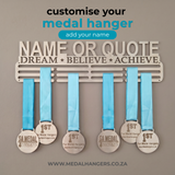 Medal hanger with blue ribbons and medals on a gray background, featuring text to customize the medal hanger from SA Medal Hangers Customised Personalised medal display