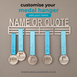Medal hanger with medals hanging on a gray background, featuring text to customize the name or quote by SA Medal Hangers 