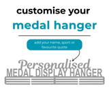 Customizable metal medal display hanger graphic on a white background, with text reading 'customise your medal hanger,' a teal label saying 'add your name, sport or favourite quote,' and a gray sample hanger reading 'Personalised MEDAL DISPLAY HANGER.'.