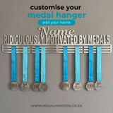 Medal hanger with blue ribbons and medals on a gray background, featuring text to customize the medal hanger from SA Medal Hangers Customised Personalised medal display Ridiculously motivated by medals