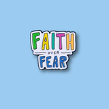Colorful 'Faith Over Fear' enamel pin on a light blue background SA Medal hangers