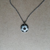 Soccer Ball Engraved on a stainless steel disc pendant on chain.