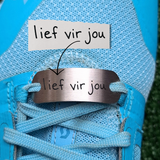 A personalised  Shoe Tag, engraved with your own or your child's handwriting. Stainless Steel, hand written