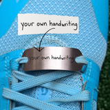 A personalised  Shoe Tag, engraved with your own or your child's handwriting. Stainless Steel, hand written