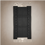 Belt display for martial arts belts and medals with the option to personalise the hanger on a gray background. The name Daniel is on this one