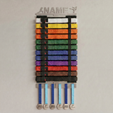 Belt display with colorful martial arts belts and medals with the option to personalise the hanger on a gray background