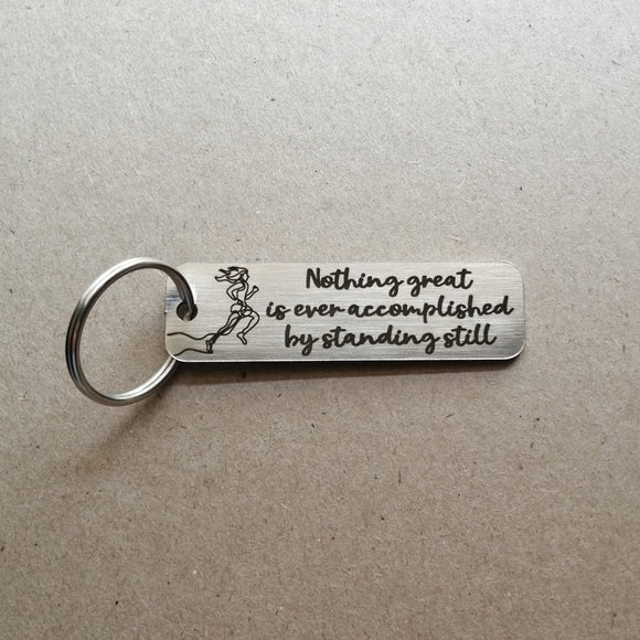 Nothing great is ever accomplished by standing still - Motivational Keyring